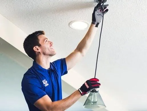 Electrician Installing Lighting Fixture - Electrician Near Me in Brooks